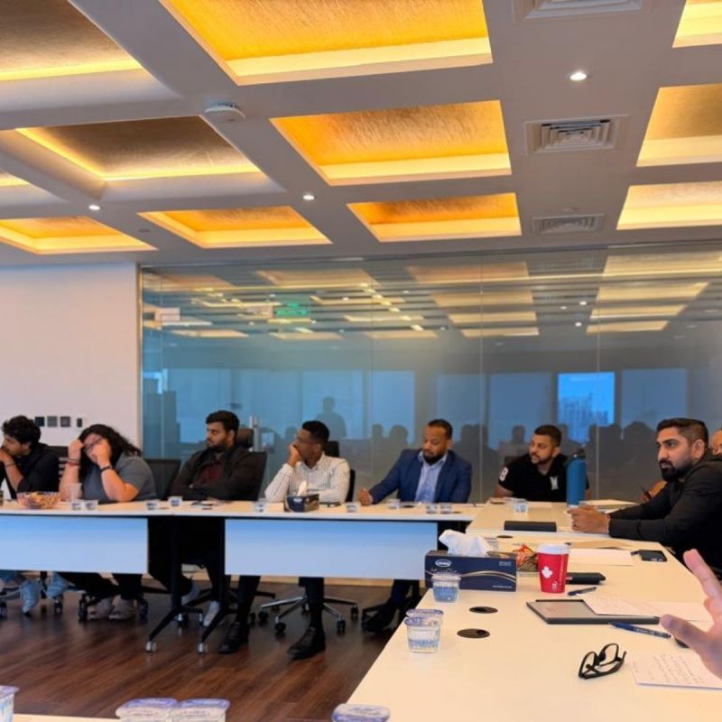 Colleagues from Tayseer Innovations and Seer Solutions during a group exercise.