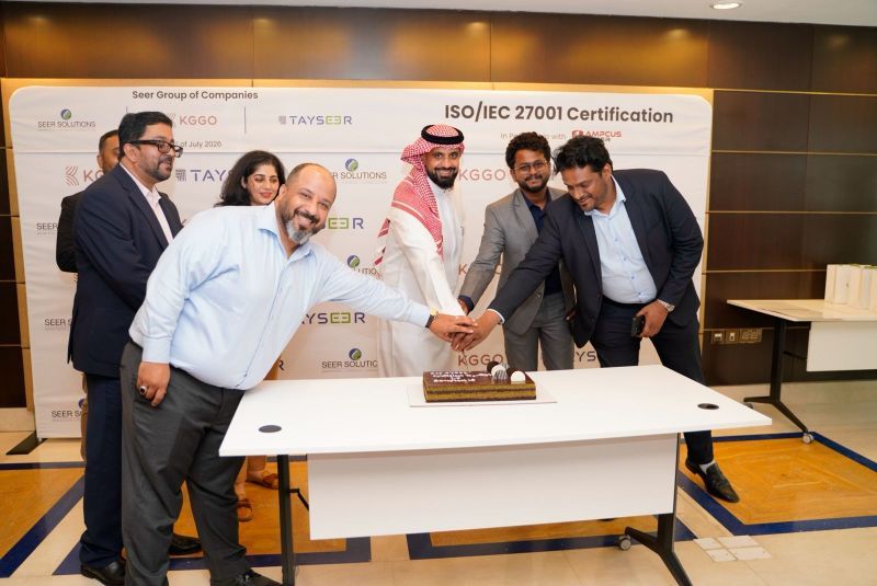 Members of the Tayseer Innovations team holding the ISO 27001 certificate.